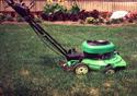 Green pushmower designed for chipping and side ejecting debris